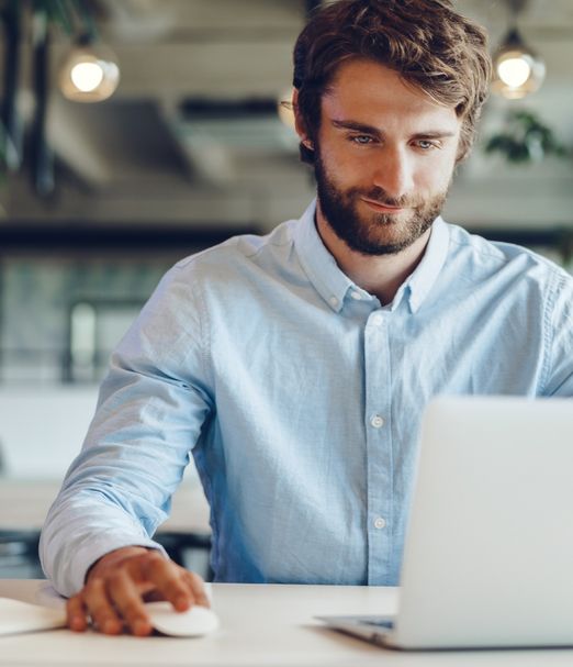 man blue shirt laptop