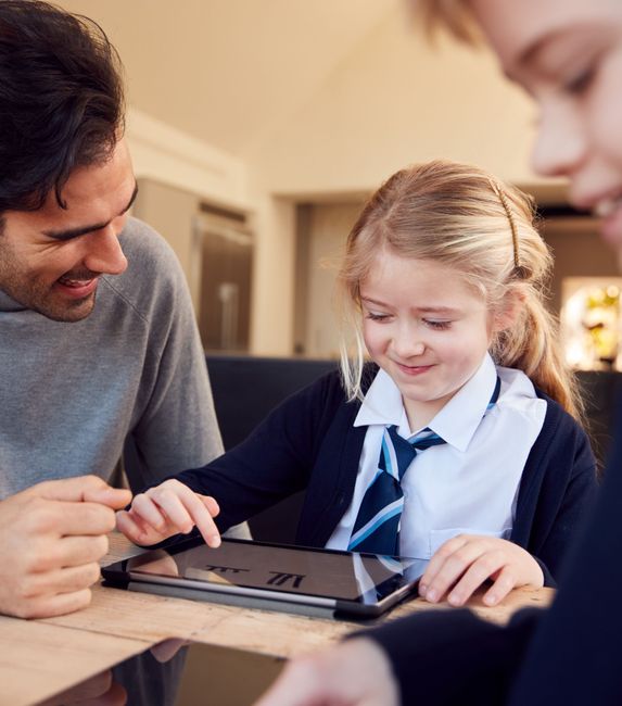 child with tablet and teacher (2)