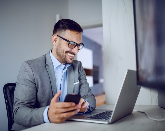 man smart suit glasses laptop