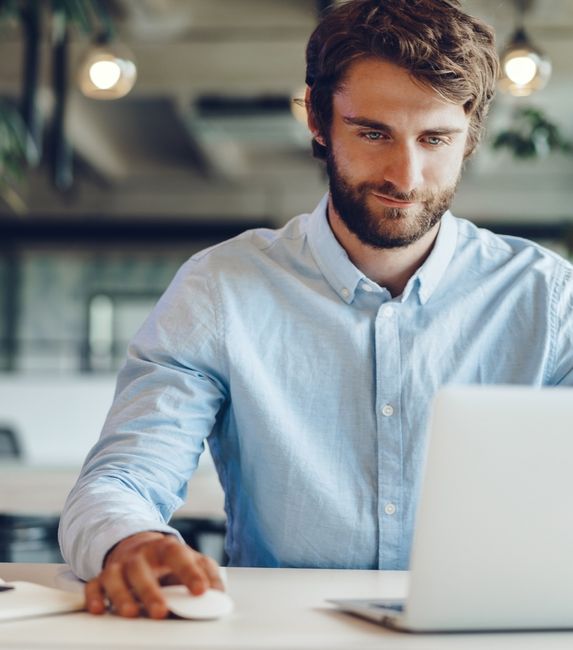 man blue shirt laptop