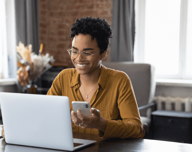 WOman on phone and laptop