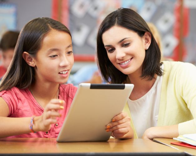 school child on ipad