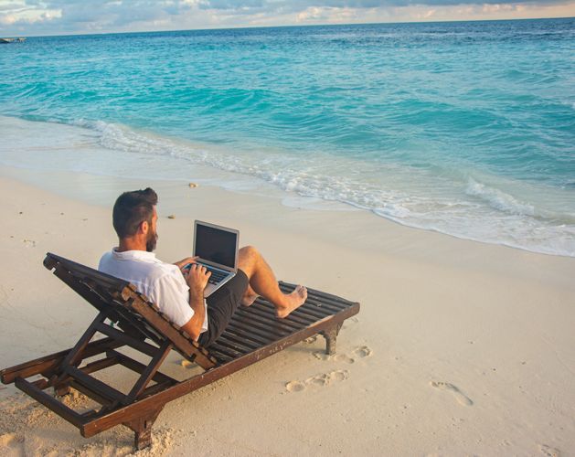 Laptop by beach
